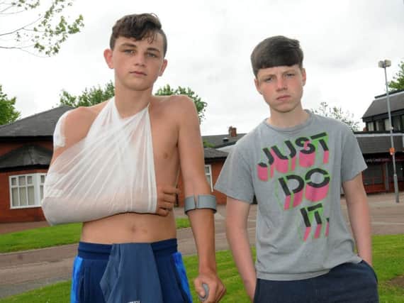 WIGAN 07-07-17
from left, Diago Price, 14, and friend Paddy Brady, 14, from Ince, were riding a bike and had a collision in Wigan town centre, they want to thank an off-duty nurse who helped them.