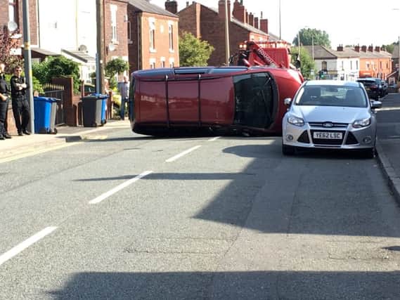 An overturned car on St James Road, Orrell.