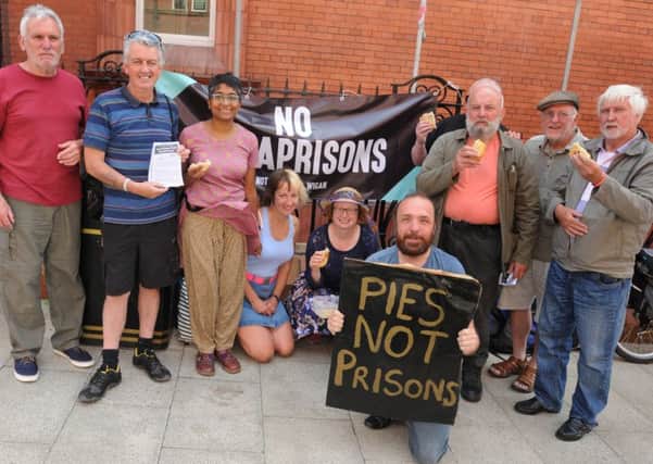 Campaigners against the proposed expansion of HMP Hindley, creating a mega-prison, protest outside Wigan Town Hall