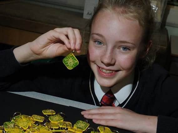 Lydia Melling with her bee keyrings