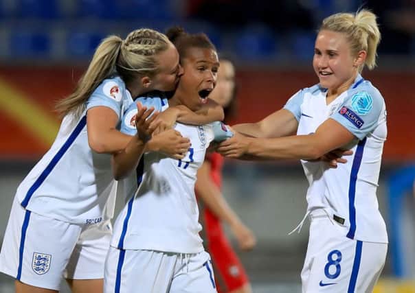 England.s Nikita Parris (centre) celebrates scoring her sides second goal of the game with team mates Toni Duggan (left) and Isobel Christiansen