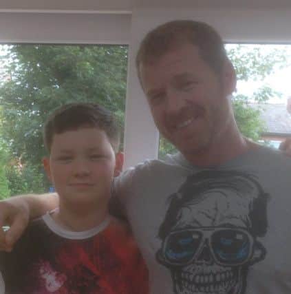 Harry Brookwell, 14, and dad Nigel Brookwell