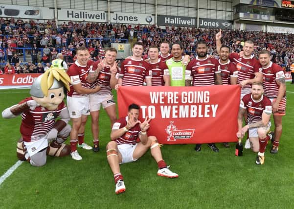 Warriors players celebrate reaching the Challenge Cup Final