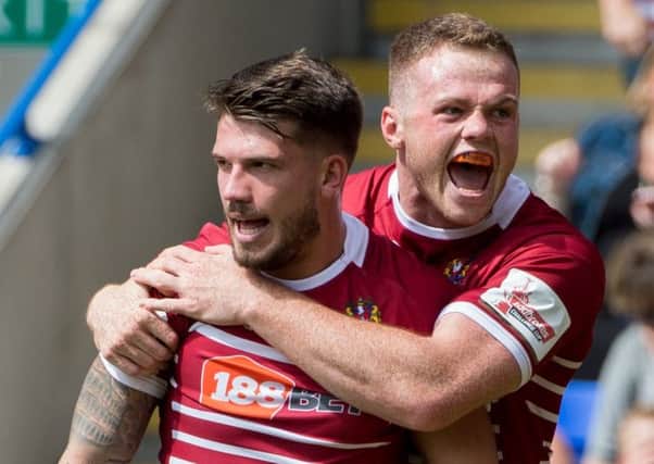 Oliver Gildart and Joe Burgess celebrate at the weekend
