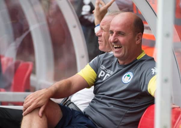 The appointment of Paul Cook has been met with the 
approval of Latics fans