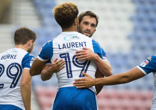Josh Laurent is congtratulated by Will Grigg