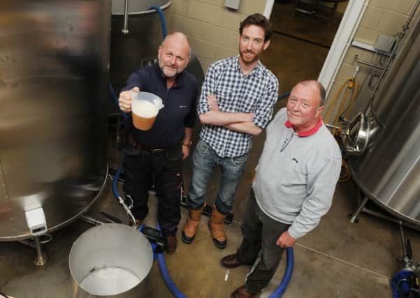 Paul Bolton is the owner of The Windmill Brewery set up at Standish Hall Farm, Standish - pictured with Brewery consultant Rob Smith and brewer Richard Anderson, right