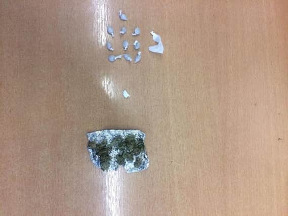 Police found 10 wraps of heroin, one of cocaine and a quantity of cannabis ready for sale.