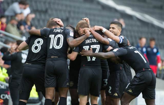 The celebrations following Nick Powell's goal at MK