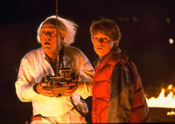 Christopher Lloyd (as Doc Emmett Brown) and Michael J Fox (as Marty McFly) in Back To the Future