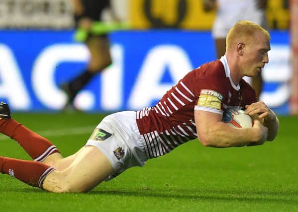 Liam Farrell crosses for a try against Huddersfield