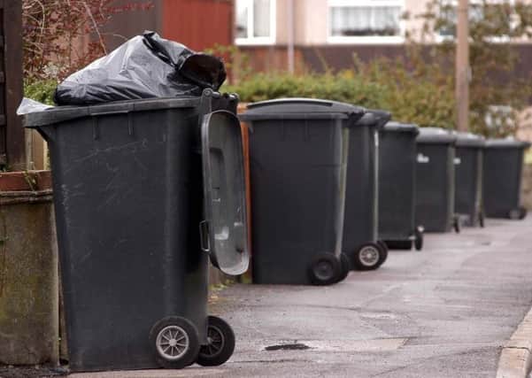 Bin collection staff are in dispute with Wigan Council