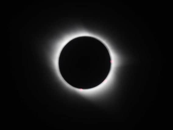 The total eclipse of the sun as viewed from onboard Virgin Atlantic Boeing 787 Dreamliner flight VS5 from London's Heathrow airport to Miami