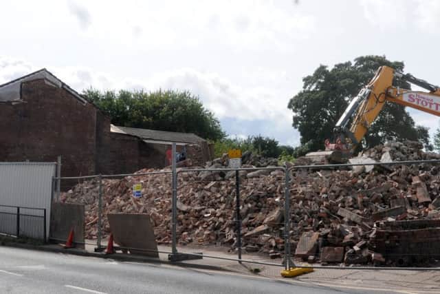 A pile of bricks and rubble, the site of Ashton-in-Makerfield Town Hall