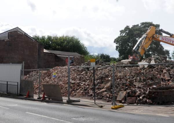 A pile of bricks and rubble, the site of Ashton-in-Makerfield Town Hall