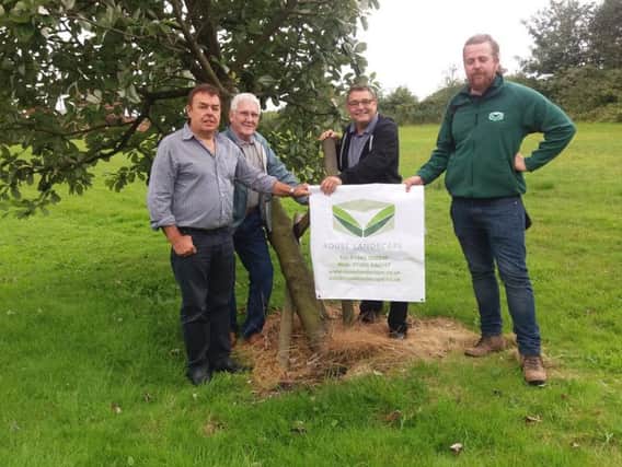 Andrew Rouse, right, from Rouse Landscaping, is doing some work for free on weather-damaged trees and fencing in Aspull, Whelley and New Springs. He's pictured with ward councillors Ron Conway, John Hilton and Chris Ready.