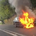 Vauxhall Astra on fire on Warrington Road
