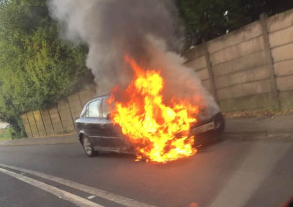 Vauxhall Astra on fire on Warrington Road
