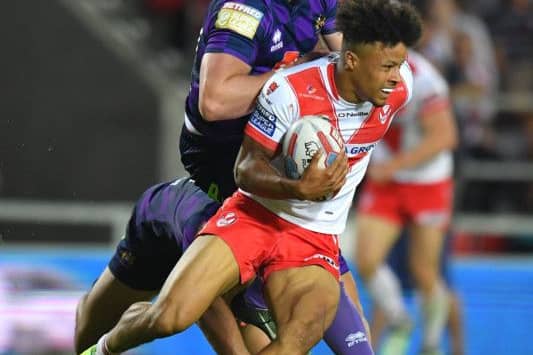 St Helens' Regan Grace is tackled by Wigan Warriors' Jack Wells 

Betfred Super League match at the Totally Wicked Stadium, St Helens. Picture by DAVE HOWARTH for Bernard Platt. Picture date: Thursday May 25, 2017