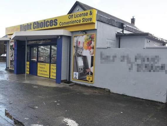 The shop which has been vandalised with racist graffiti
