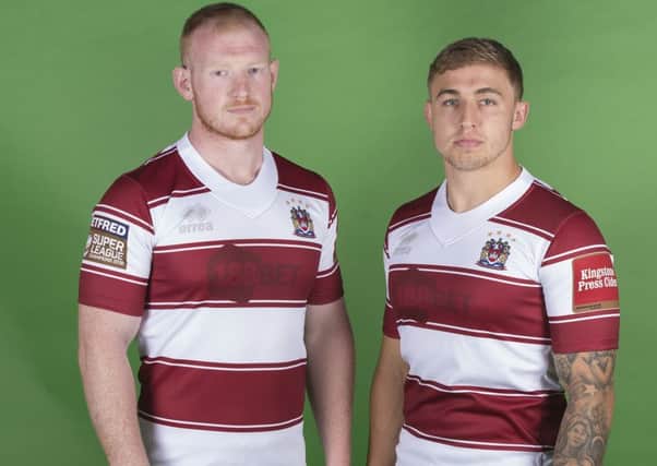 Liam Farrell and Sam Powell model the shirt Wigan will wear against Castleford on Sunday