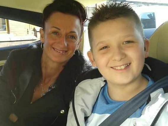 Kyle Buckley, 12, with his mum Carol