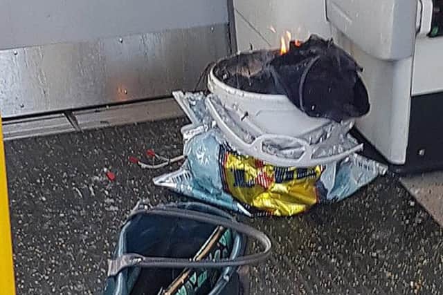 A bucket on fire on a tube train at Parsons Green station in west London amid reports of an explosion.