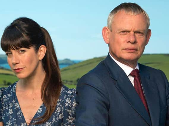 Martin Clunes as Dr. Martin Ellingham and Caroline Catz as Louisa Ellingham