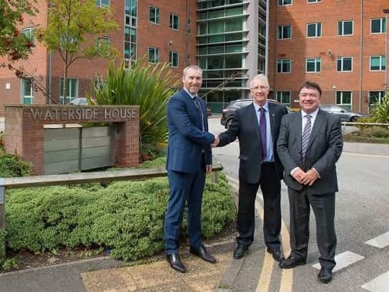 Richard Calvert, chief executive of Shearings, with deputy council leader David Molyneux and Gary Speakman, chief financial officer of Shearings