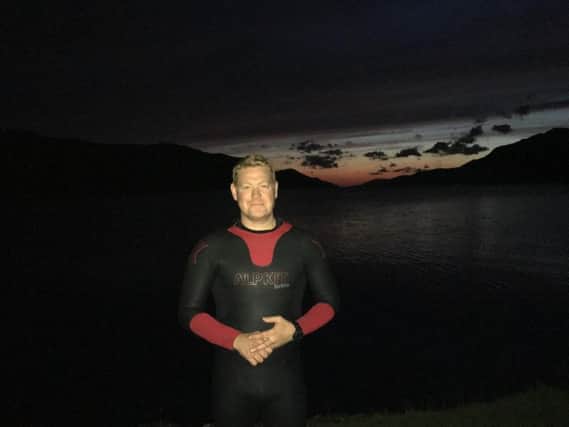Flight Lieutenant Ian Smith, from Wigan, prepares to swim the length of Loch Ness to raise money for Ovarian Cancer Action in memory of his mum