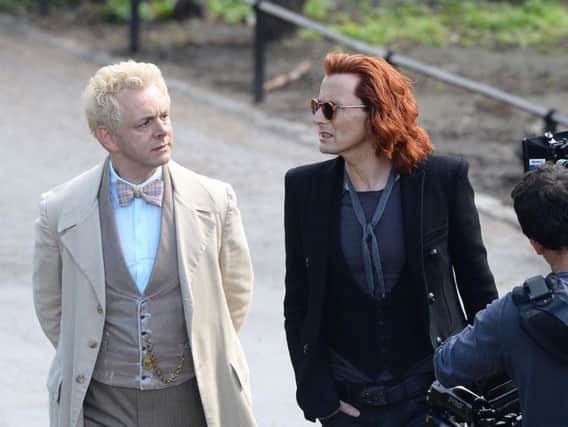 Michael Sheen (white coat) with co-star David Tennant (red hair)