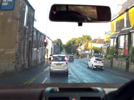 The Kia speeds through the red light