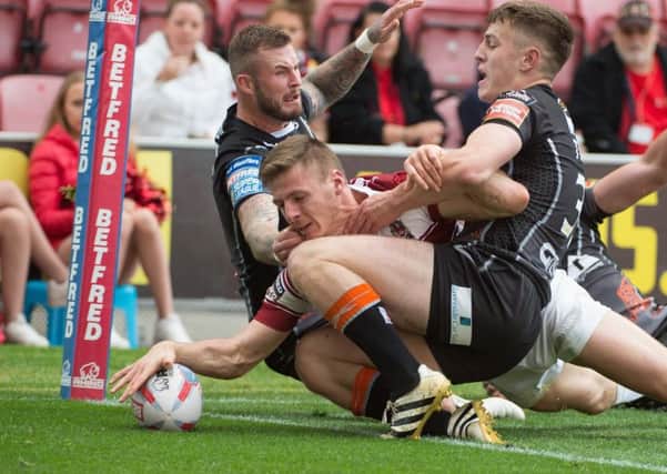 Tom Davies crosses for a try against Castleford