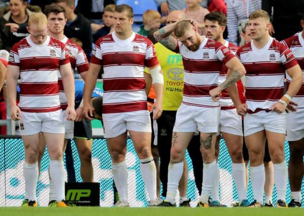 Wigan players look dejected after the loss to Castleford