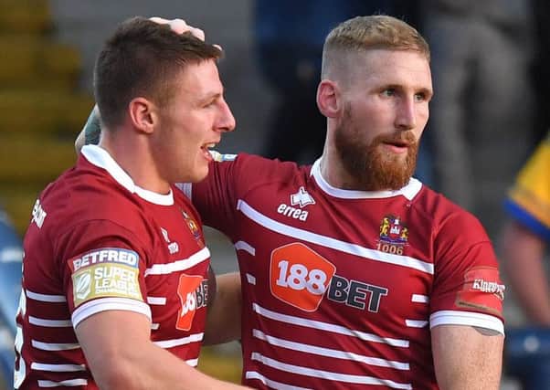 Tom Davies and Sam Tomkins were unable to prevent Wigan slipping to defeat