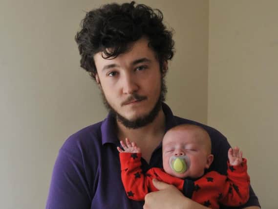 Ryan McGrath with 10-week-old son Kai