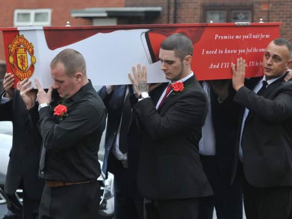 Neil was laid to rest in a Manchester United-themed coffin as hundreds of mourners attended the church to pay tribute to him.