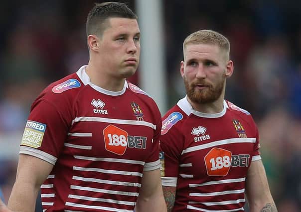 Joel Tomkins (left) with brother Sam during Wigan's defeat to Wakefield last month