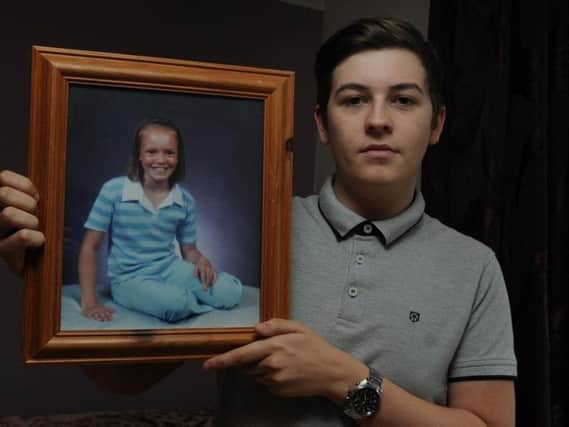 Jack Goodison with a picture of his sister Rebecca Harrison