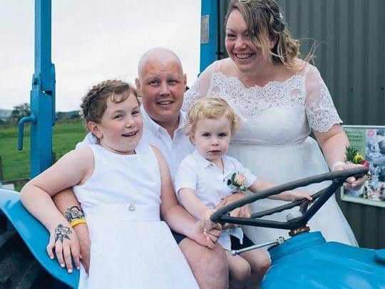 Chris and Becky renewed their wedding vows in June. Pictured with children Lily and Sam