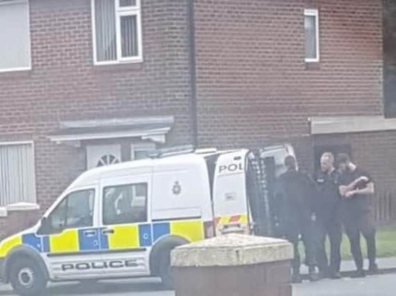Police surround a vehicle at the Norley Hall estate