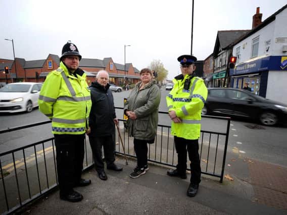 Councillors George Fairhurst and Debbie Fairhurst at the junction with Sgt Nick Forshaw and PCSO Barry Smith