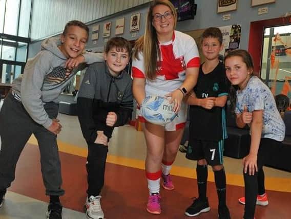England Womens RL international Rachel Thompson with some of  the young people at Wigan Youth Zone