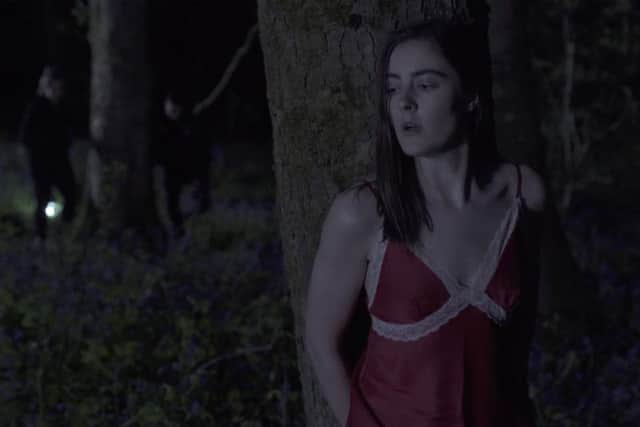 Actress Alice Brides starts in a scene from the film, shot in Pemberton Woods.