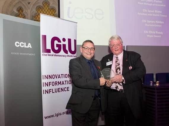 Coun Ready is presented with his award by Coun Paul Bettison, leader of Bracknell Forest Council