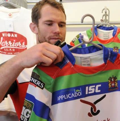 Pat Richards checks out the Joining Jack Wigan shirt in 2012