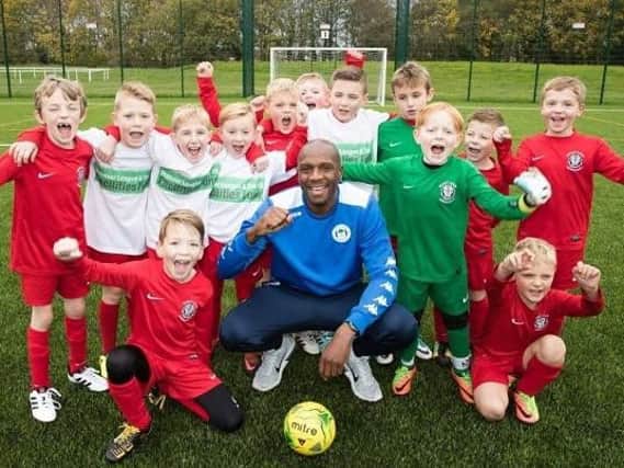 Emmerson Boyce with youngsters at the launch of the 3G all-weather community football hub at Little Lane, Goose Green