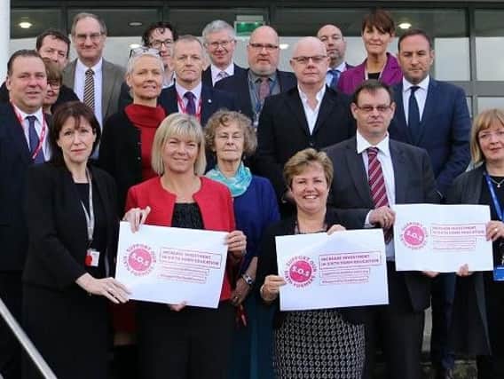 Principals, including Louise Tipping (front row far right), protest over funding levels