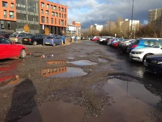The potholed car park off Rodney Street
