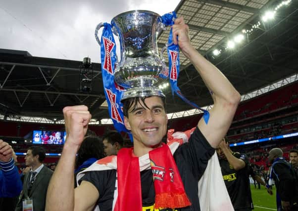 Paul Scharner helped Wigan Athletic win the FA Cup in 2013